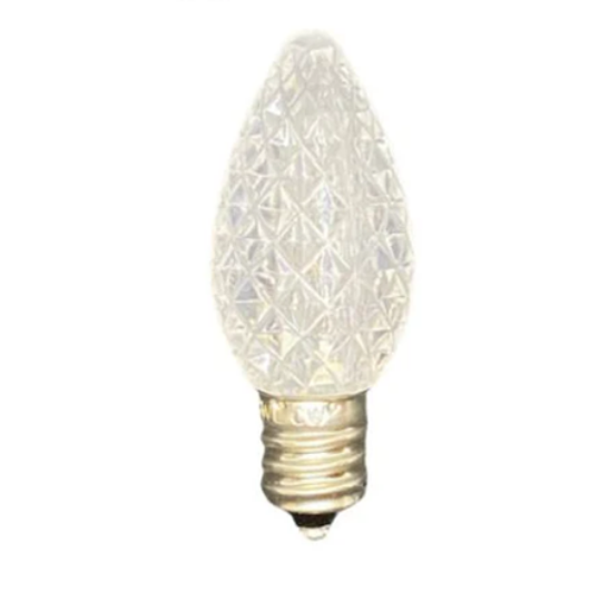 A single clear, transparent C7 LED Christmas light bulb with a silver base.