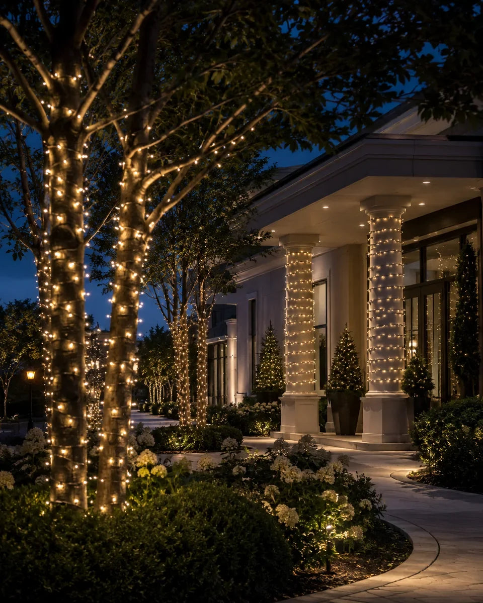 Finished columns and tree trunks wrapped with warm-white mini lights