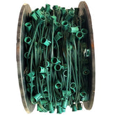 A spool of green Christmas light sockets designed for C9 LED bulbs.