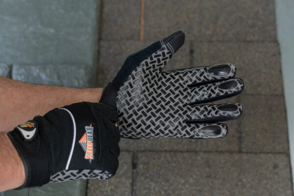 Putting on SteepGear safety gloves