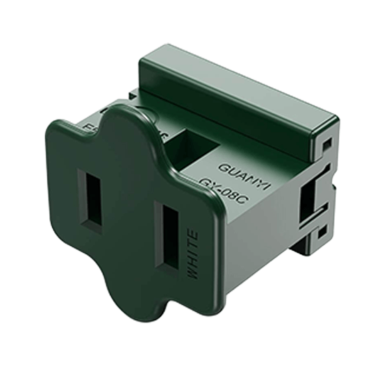 Green electrical outlet adapter on a white background