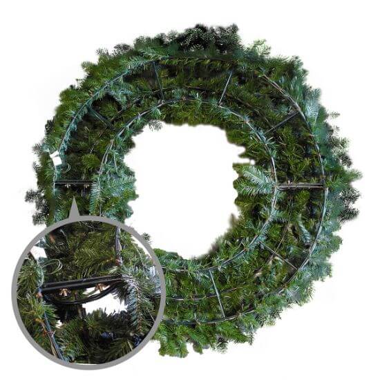 Green wreath with metal frame on a white background
